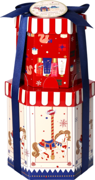 Świąteczny zestaw Magic Christmas w dwupiętrowym pudełku-karuzeli z czerwoną i kremową grafiką, niebieską wstążką.