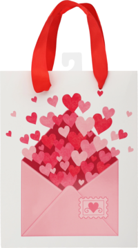 Biała torba prezentowa z czerwonymi wstążkami. Z przodu różowa koperta pełna czerwonych i różowych serc.