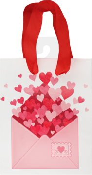Biała torebka prezentowa z czerwonymi uchwytami, z różowej koperty wysypują się serca walentynkowe w odcieniach czerwieni.