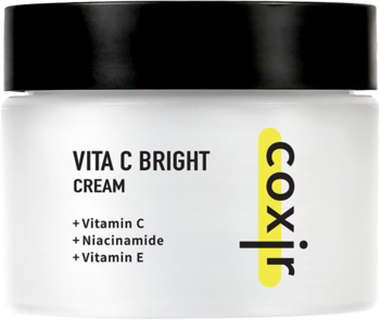 Krem Coxir Vita C Bright z witaminami C, B3, E w białym, matowym słoiku z czarną nakrętką, z przodu.