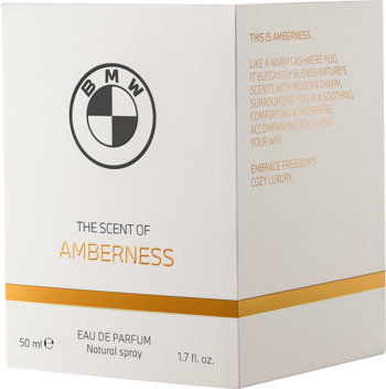 Białe pudełko BMW AMBERNESS Woda Perfumowana 50ml, widok pod kątem. Złoty pasek, logo BMW i boczny opis.