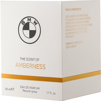 Białe pudełko BMW AMBERNESS Woda Perfumowana 50ml, widok pod kątem. Złoty pasek, logo BMW i boczny opis.