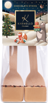 Karmello Chocolate Sticks: festive box with fox, bear, tree. Two wooden sticks dipped in milk chocolate with sprinkles.