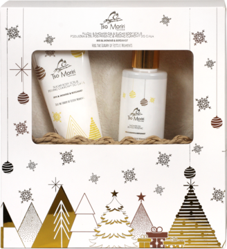 Świąteczny zestaw kosmetyków Tia Mori w białym pudełku z choinkami. Zawiera tubę i butelkę z pompką.