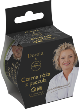 Otwarty czarny karton odświeżacza powietrza Dorota Aroma Home Czarna róża z paczulą, z portretem Doroty Szelągowskiej.