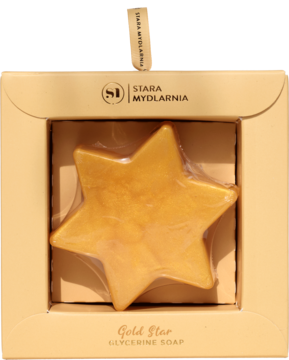 Złote mydło glicerynowe Gold Star w kształcie gwiazdki, zapakowane w otwarte beżowe pudełko.