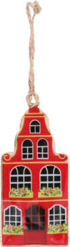 Czerwona zawieszka w kształcie kamienicy ze schodkowym szczytem, białymi oknami, skrzynkami z kwiatami i linką.