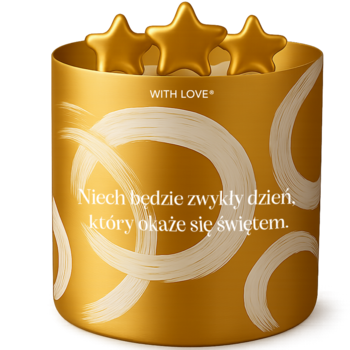 Złota świeczka sojowa z trzema gwiazdkami, napisem „Niech będzie zwykły dzień” i białymi wzorami.