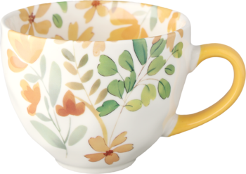 Biały ceramiczny kubek z żółtym uchem, zdobiony pomarańczowo-żółtymi kwiatami i zielonymi liśćmi, widok z boku.