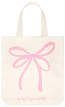 Eloy bawełniana torba ecru z dużym różowym nadrukiem kokardy i napisem lubię być sobą, widok z przodu.
