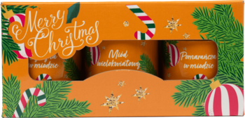 Pomarańczowy świąteczny zestaw prezentowy z trzema miodami. Pudełko z choinką, cukrowymi laskami i napisem 'Merry Christmas'.
