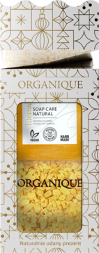 Organique Soap Care Natural, mydło wegańskie ręcznie robione w białym pudełku z żółtymi płatkami i złotymi ozdobami.