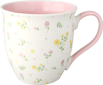 Biały ceramiczny kubek z różowym wnętrzem i uchem, ozdobiony delikatnym kwiatowym wzorem w pastelach.