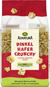 Alnatura Dinkel Hafer Crunchy BIO, pełnoziarniste płatki orkiszowo-owsiane w przezroczystej torbie, widok z przodu.