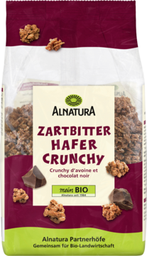 Duża torebka Alnatura Zartbitter Hafer Crunchy z chrupkami owsianymi i gorzką czekoladą, biała etykieta, przód.