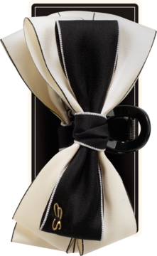 Klamra do włosów Ewa Schmitt RKK112. Duża, elegancka kokarda z warstwowych wstążek, czarno-kremowa, z logo ES.