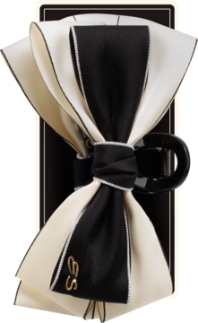 Klamra do włosów Ewa Schmitt RKK112. Duża, elegancka kokarda z warstwowych wstążek, czarno-kremowa, z logo ES.