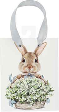 Biała torba prezentowa z motywem królika trzymającego kosz konwalii. Błękitne uchwyty, widok z przodu.