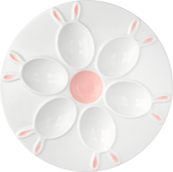 Biała ceramiczna paterka na 6 jajek wielkanocnych z różowymi króliczymi uszkami i środkiem. Widok z góry, wzór kwiatka.