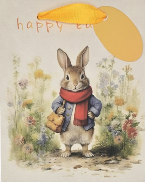 Torba prezentowa Wielkanocna z ilustracją królika w niebieskim płaszczu, czerwonym szaliku, wśród kwiatów, z żółtą rączką.