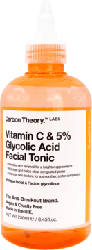 Przezroczysta butelka Carbon Theory Vitamin C & 5% Glycolic Acid Facial Tonic z pomarańczowym płynem, widok z przodu.