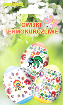 Owijki termokurczliwe: trzy wielkanocne pisanki z barwnymi, ludowymi wzorami na rozmytym tle wiosennych kwiatów.