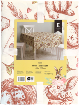 Zdjęcie opakowania obrusa z kremowym tłem, brązowymi królikami i kwiatowym wzorem vintage, z etykietą.