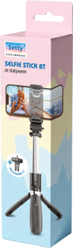 Różowe pudełko z selfie stickiem Setty BT ze statywem, widok z przodu, z telefonem w uchwycie.