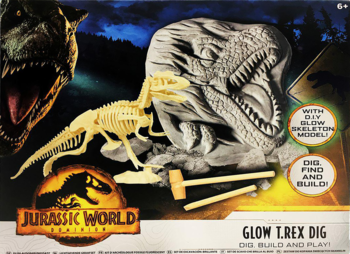 Zestaw Jurassic World Glow T. Rex Dig: pudełko z szarym blokiem, żółtym szkieletem i narzędziami do wykopalisk.