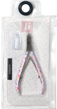 Cążki do skórek z różowymi uchwytami we wzory, w blistrze z ochronną nakładką, widok z przodu.