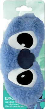 Fluffy blue plush Stitch night mask, featuring big white eyes and a dark blue nose, on retail packaging.