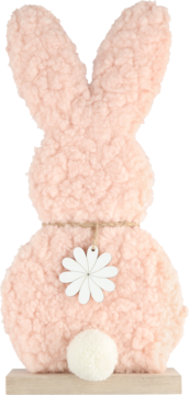 Różowy dekoracyjny zajączek z puszystej tkaniny, widok z tyłu, z białą drewnianą stokrotką i pomponem, na drewnianej podstawie.