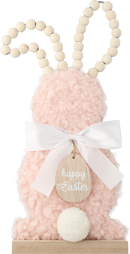 Różowy fluffy zając wielkanocny z białymi pomponowymi uszami, kokardą i drewnianą zawieszką "happy Easter" na podstawie.