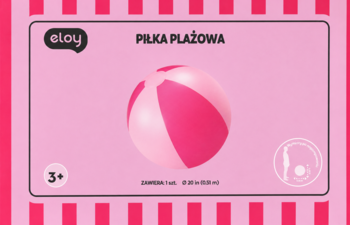 Różowo-jasnoróżowa piłka plażowa Eloy w paski, widok z przodu, na kartonie z różowymi pasami, wiek 3+.