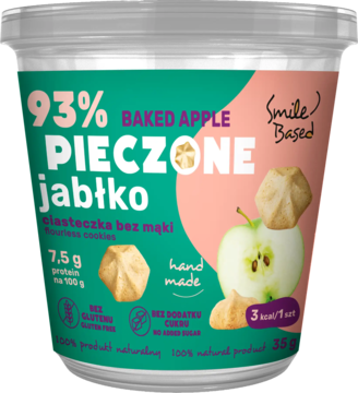 Deser Smile Based pieczone jabłko 35g w przezroczystym kubeczku, zielono-różowa etykieta, z jabłkiem i ciastkami.