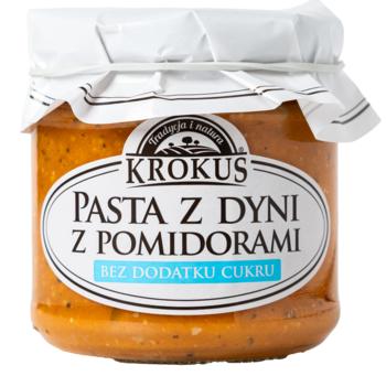 Krokus Pasta z dyni z pomidorami w szklanym słoiku, widok z przodu, pomarańczowa z białą etykietą Bez Dodatku Cukru.