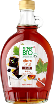 EnerBiO syrop klonowy Grad C w szklanej butelce z uchwytem, przód z etykietą i liśćmi klonu.