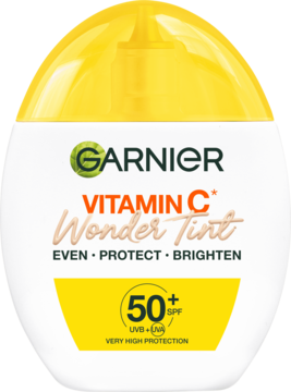 Biała butelka Garnier Vitamin C Wonder Tint SPF 50+, pomarańczowy napis, żółta nakrętka, widok z przodu.