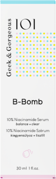 Serum Geek & Gorgeous 101 B-Bomb, 10% Niacinamide, w białym opakowaniu z różowymi i niebieskimi kropkami, widok z przodu.