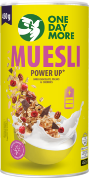 Yellow One Day More Muesli Power Up canister. Muesli with dark chocolate, pecans, and cherries pouring into a milk-filled bowl.