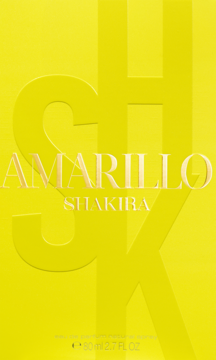 Żółte pudełko perfum Shakira Amarillo z wytłoczonym logo SHK, widok z przodu, pojemność 80 ml.