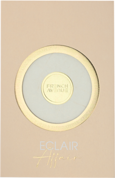 Opakowanie French Avenue Eclair Affair, jasnobeżowe ze złotą obwódką i logo pośrodku. Widok z przodu.
