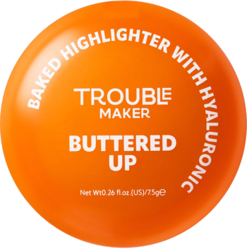 Pomarańczowy, okrągły rozświetlacz Trouble Maker Buttered Up, wypiekany z hialuronowym. Widok z góry.