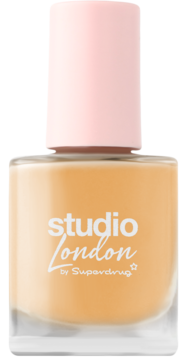 Studio London lakier do paznokci nude w szklanej butelce z jasnoróżową nakrętką, widok z przodu.