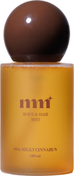 Mgiełka do ciała i włosów mm Milky Cinnabun 100 ml, matowa bursztynowa butelka z brązową, okrągłą nakrętką, widok z przodu.