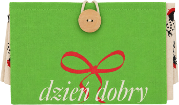 Zielona torba bawełniana Eloy z napisem "dzień dobry", czerwoną kokardą, guzikiem i wzorzystymi bokami.