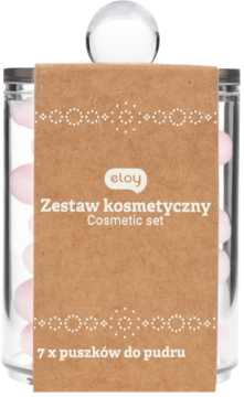 Zestaw kosmetyczny Eloy: 7 różowych puszków do pudru w przezroczystym cylindrze z brązową etykietą, widok z przodu.
