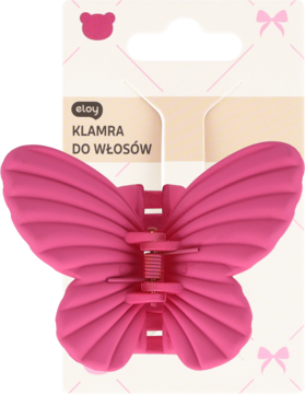 Ciemnoróżowa klamra do włosów Eloy w kształcie motyla, matowa, żebrowane skrzydła, widok z przodu w opakowaniu.