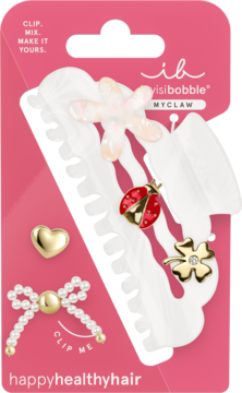 Invisibobble MYCLAW: białe klipsy do włosów z odpinanymi charmsami: kwiat, biedronka, koniczyna, na różowym blistrze.
