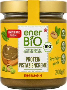 Słoik organicznej Protein Pistaziencreme enerBiO (200g) z żółtą etykietą. Widok z przodu, pistacje, chleb z kremem.